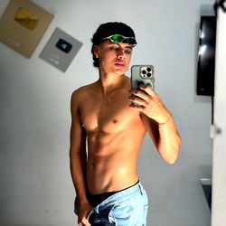 Fitness Model Alexius Poses for Selfie