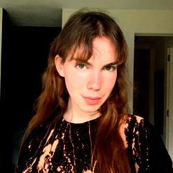 Model Jules North, From Belgium: Posed Photograph with Long Hair and Chic Outfit