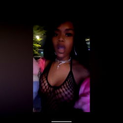 Tiny, a Baltimore-based model in racy attire