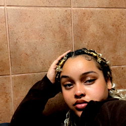 Arianna, a model, taking a break in the bathroom