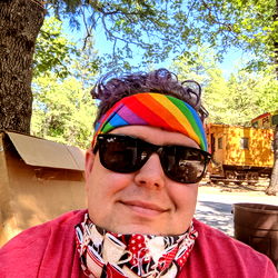 Colorful Bandana on Face of Man with Hoodie