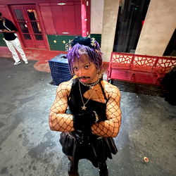 Strong, Confident Battybat Embracing Power in Her Costume