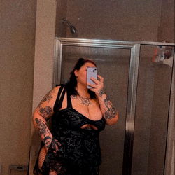 Stunning OnlyFans Model 'Mommy' Posing in Bathrobe with Tattoos