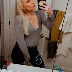 Blonde Model in Bathroom Mirror