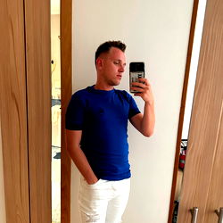 Model in White Jeans and Blue T-Shirt