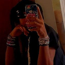 A young woman sitting with a phone