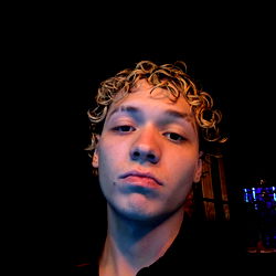 Young Adult Male with Blonde Hair and Curly Locks