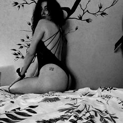 Ainhoa OnlyFans Model in a Romantic Striped Bed Setting