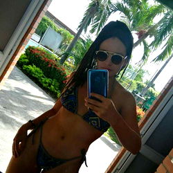 Model in Swimsuit Taking a Selfie