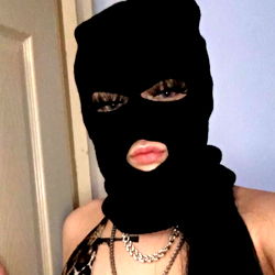 Model in Black Mask and Latex Outfit