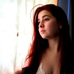 Almendra Nena, a Model Photo with a Soft Focus and a Window in the Background