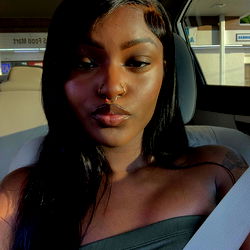 Amy Love, a stunning model in the backseat of a car