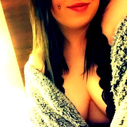 KT, a model on OnlyFans, captured in a cozy home setting.