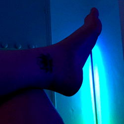 Intimate Scene with a Model in a Neon-Lit Space