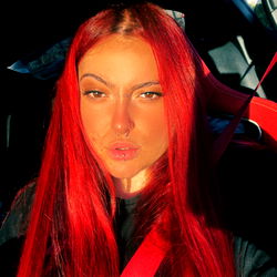 Red-haired individual with bright red hair,