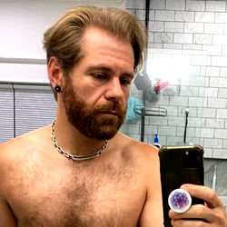 Bearded Man in Shirtless Selfie