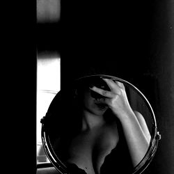 Model Flor Hernandez Reflects in Mirror