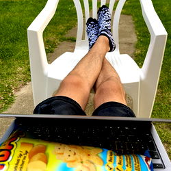 A Casual Scene with a Laptop and Snacks