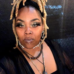 Beautifully Styled Woman in Rasta Cap and Dress