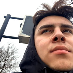 Personal Profile of a Man with a Black Jacket and Hoodie, Looking Ahead