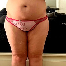 Full-body image of an adult individual wearing a lingerie, standing in front of a mirror. OnlyFans handle: Betina poulsen VIP❤️. From Denmark.