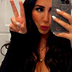 Glamorous Model Ali Poses with Smartphone