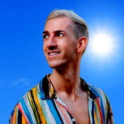 Model in Colorful Shirt, Looking Towards Sun