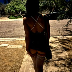 Stylish Model Walking Away from a Street