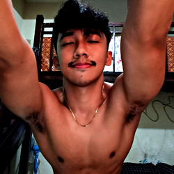 OnlyFans Model AGBIH, Strong Biceps, Intrigued Expression