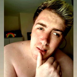 Aaron Derby's Shirtless Selfie with Finger on Mouth