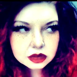 Stylish Redhead with Dark Eyes