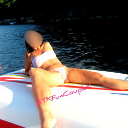 A young woman relaxing on a boat