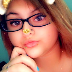 Stylish Woman in Gold-themed Snapchat Filter with Bear Ears