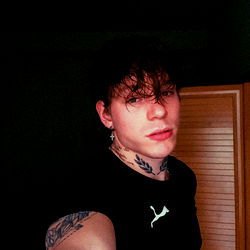 Young Male in Tattooed Sleeves and Black Tee
