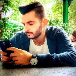 Casually Dressed Man Texting on Phone