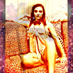 Glamorous Model Sitting on Couch