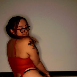 Aries: A Sexy Model in a Red Cage Bra