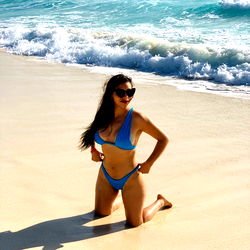 Elizabeth Quiroz poses on a beach