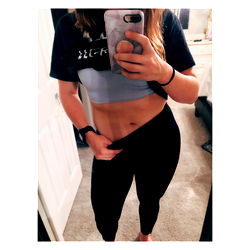 Fitness Model Showcases Abs in Mirror Selfie