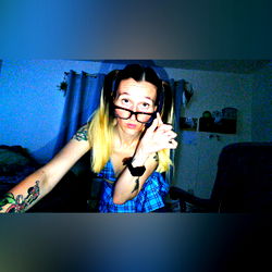 Playful OnlyFans Model in a Blue Room