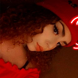 Model Angel in Red Dress with Halo