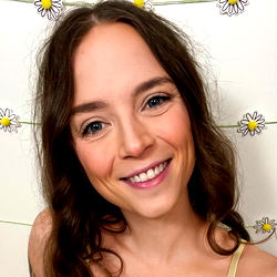 Smiling Woman with Daisy Hairband