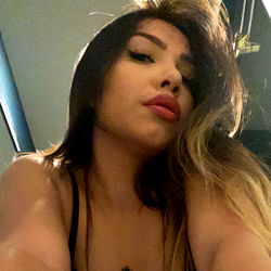 Onlyfans Model Henesis in a Playful Pose