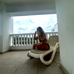 Onlyfans Model Spicyyblonde in Bikini Sitting on Balcony