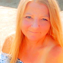 A warm smile against the backdrop of a sunny day