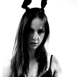 Authentic Woman Model in Rabbit Ears and Tattoos,