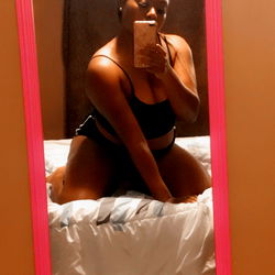 Model in Black Lingerie Posing for a Selfie