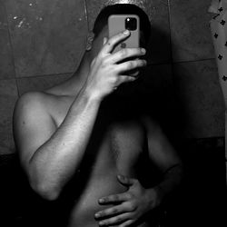 A Shirtless Model in the Bathroom