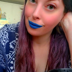 A Woman in a Cozy Room with Blue Lipstick