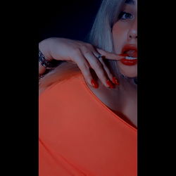 OnlyFans Model Baby Alo with Red Nails and Orange Tank Top